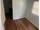 Small bedroom with hardwood floors and bathroom access at 8004 N 11Th St, Tampa, FL 33604