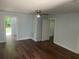 Living room with hardwood floors and ceiling fan at 8004 N 11Th St, Tampa, FL 33604