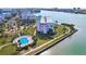 Stunning waterfront condo with a pool and lush landscaping overlooking the beautiful bay and waterfront views at 8040 Sailboat Key S Blvd # 304, St Pete Beach, FL 33707