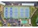 Overhead shot showcasing well-maintained tennis courts and shuffle board for recreational activities at 8040 Sailboat Key S Blvd # 304, St Pete Beach, FL 33707