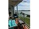 Balcony with furniture offers relaxing views of the Intercoastal Waterway at 8040 Sailboat Key S Blvd # 304, St Pete Beach, FL 33707