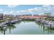 Scenic marina view with numerous boats docked and waterfront condos in the background at 8040 Sailboat Key S Blvd # 304, St Pete Beach, FL 33707