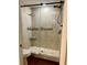 This bathroom has a shower with stylish tile and a glass door at 8040 Sailboat Key S Blvd # 304, St Pete Beach, FL 33707