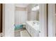 Bright bathroom with white vanity, framed mirror and bath tub with a shower at 814 Tuscanny St, Brandon, FL 33511