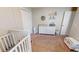 Cozy bedroom featuring neutral walls, plush carpet, changing table and ceiling fan at 814 Tuscanny St, Brandon, FL 33511