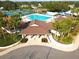 Aerial view of the community pool with a gathering space and tennis courts at 814 Tuscanny St, Brandon, FL 33511