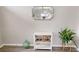 Sitting room features stylish accents, a decorative mirror, a plant in a white pot, and wood look flooring at 814 Tuscanny St, Brandon, FL 33511