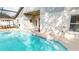 Screened-in pool area with a view of the home's back exterior and patio area at 814 Tuscanny St, Brandon, FL 33511