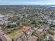 Aerial view of townhomes in a lush, waterfront community at 868 Date Palm Ln, St Petersburg, FL 33707