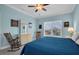 Comfortable bedroom featuring soft lighting, light-colored walls, and serene outdoor views at 868 Date Palm Ln, St Petersburg, FL 33707