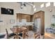 Open dining area with stainless steel appliances and modern finishes at 868 Date Palm Ln, St Petersburg, FL 33707