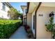 Inviting exterior of this townhouse featuring desert landscaping and a well-lit walkway at 868 Date Palm Ln, St Petersburg, FL 33707