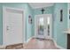 Bright foyer with tile flooring, and an elegant front door featuring decorative glass at 868 Date Palm Ln, St Petersburg, FL 33707