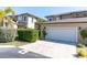 Exterior view of the home with a well-maintained lawn and a two-car garage at 868 Date Palm Ln, St Petersburg, FL 33707