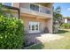 Outdoor patio with brick flooring, French doors and a small table and chairs at 868 Date Palm Ln, St Petersburg, FL 33707