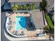 Aerial view of the pool area with lounge chairs and tables for relaxation at 868 Date Palm Ln, St Petersburg, FL 33707