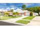 Light coral house with a white garage door and palm trees at 8807 Oak Cir, Tampa, FL 33615