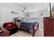 Bedroom with ceiling fan, window with blinds and hardwood floors at 8903 Bay Bridge Ct, Tampa, FL 33634