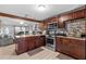 Modern kitchen featuring granite countertops, stainless steel appliances, and ample cabinet space at 8903 Bay Bridge Ct, Tampa, FL 33634