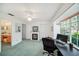 Bedroom with large window, ceiling fan, and built-in shelving at 949 Hamilton Ct, Palm Harbor, FL 34683