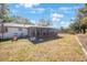 Backyard featuring a covered patio, greenery, and ample room for recreation at 10201 127Th Pl, Largo, FL 33773