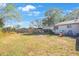 Spacious backyard featuring a playset and ample area for outdoor enjoyment at 10201 127Th Pl, Largo, FL 33773