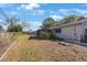 Backyard featuring lush greenery, a patio, and plenty of space for outdoor living at 10201 127Th Pl, Largo, FL 33773