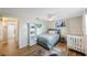 Well-lit bedroom featuring wood floors, neutral tones, and a ceiling fan at 10201 127Th Pl, Largo, FL 33773