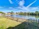 Backyard overlooking water great for lounging and recreational activities, and is fenced in at 10839 Venice Cir, Tampa, FL 33635