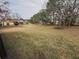View of the backyard through a screened enclosure at 11425 Billingham Blvd, Spring Hill, FL 34609