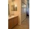 Bathroom with single sink, vanity, and linen closet at 11425 Billingham Blvd, Spring Hill, FL 34609