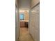 View of bathroom vanity, double closets and tiled floors at 11425 Billingham Blvd, Spring Hill, FL 34609