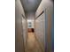 Bathroom with double closets and view of vanity and tiled floor at 11425 Billingham Blvd, Spring Hill, FL 34609