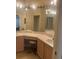 Bathroom with double sinks, vanity, and large mirror at 11425 Billingham Blvd, Spring Hill, FL 34609