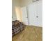 Bonus room with tiled floors and a plaid couch at 11425 Billingham Blvd, Spring Hill, FL 34609