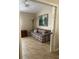 Cozy den with plaid couch and large landscape painting at 11425 Billingham Blvd, Spring Hill, FL 34609
