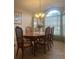 Bright dining room featuring a formal table and ample natural light at 11425 Billingham Blvd, Spring Hill, FL 34609