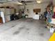 Attached garage with ample storage shelving and space for vehicles at 11425 Billingham Blvd, Spring Hill, FL 34609