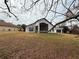Back of house with covered patio and large backyard at 11425 Billingham Blvd, Spring Hill, FL 34609