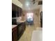 Kitchen with dark wood cabinets and a breakfast nook at 11425 Billingham Blvd, Spring Hill, FL 34609