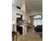 Open concept living area with high ceilings and access to kitchen at 11425 Billingham Blvd, Spring Hill, FL 34609