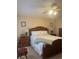 Main bedroom with king-size bed, wood furniture, and carpeted floors at 11425 Billingham Blvd, Spring Hill, FL 34609