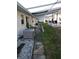 Backyard walkway with patio area and central air conditioning unit at 12400 Park Blvd # 417, Seminole, FL 33772