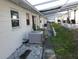 Backyard walkway with patio area and central air conditioning unit at 12400 Park Blvd # 417, Seminole, FL 33772