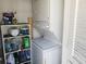 Laundry area with stacked washer and dryer and storage shelves at 12400 Park Blvd # 417, Seminole, FL 33772