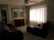 Cozy living room features comfortable seating, a decorative cabinet, and a serene painting at 12400 Park Blvd # 417, Seminole, FL 33772