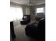 Comfortable living room with bright, natural light and stylish, neutral decor, perfect for relaxing or entertaining at 12400 Park Blvd # 417, Seminole, FL 33772
