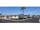 Neighborhood street showcasing well-maintained villa-style homes and lush landscaping under a clear blue sky at 12400 Park Blvd # 417, Seminole, FL 33772
