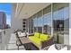Relaxing balcony with wicker furniture and a view of the city at 145 2Nd S Ave # 523, St Petersburg, FL 33701