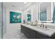 Modern bathroom with double vanity and walk in shower at 145 2Nd S Ave # 523, St Petersburg, FL 33701